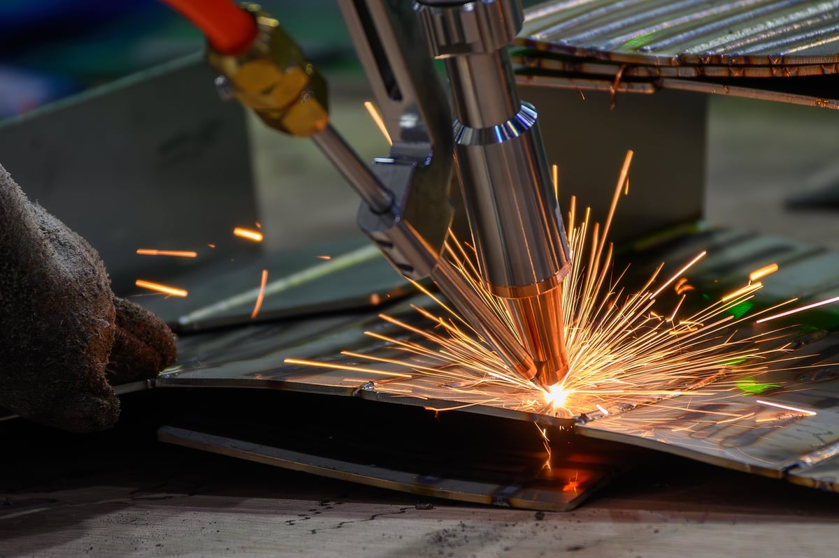 Close-up of a precision TIG welding process on stainless steel